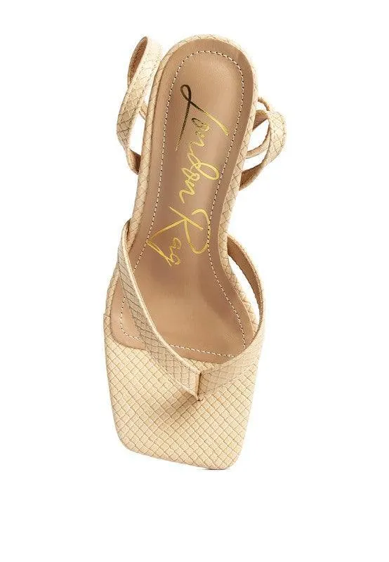 CELTY Ankle Strap Spool Heel Thong Sandals by VYSN